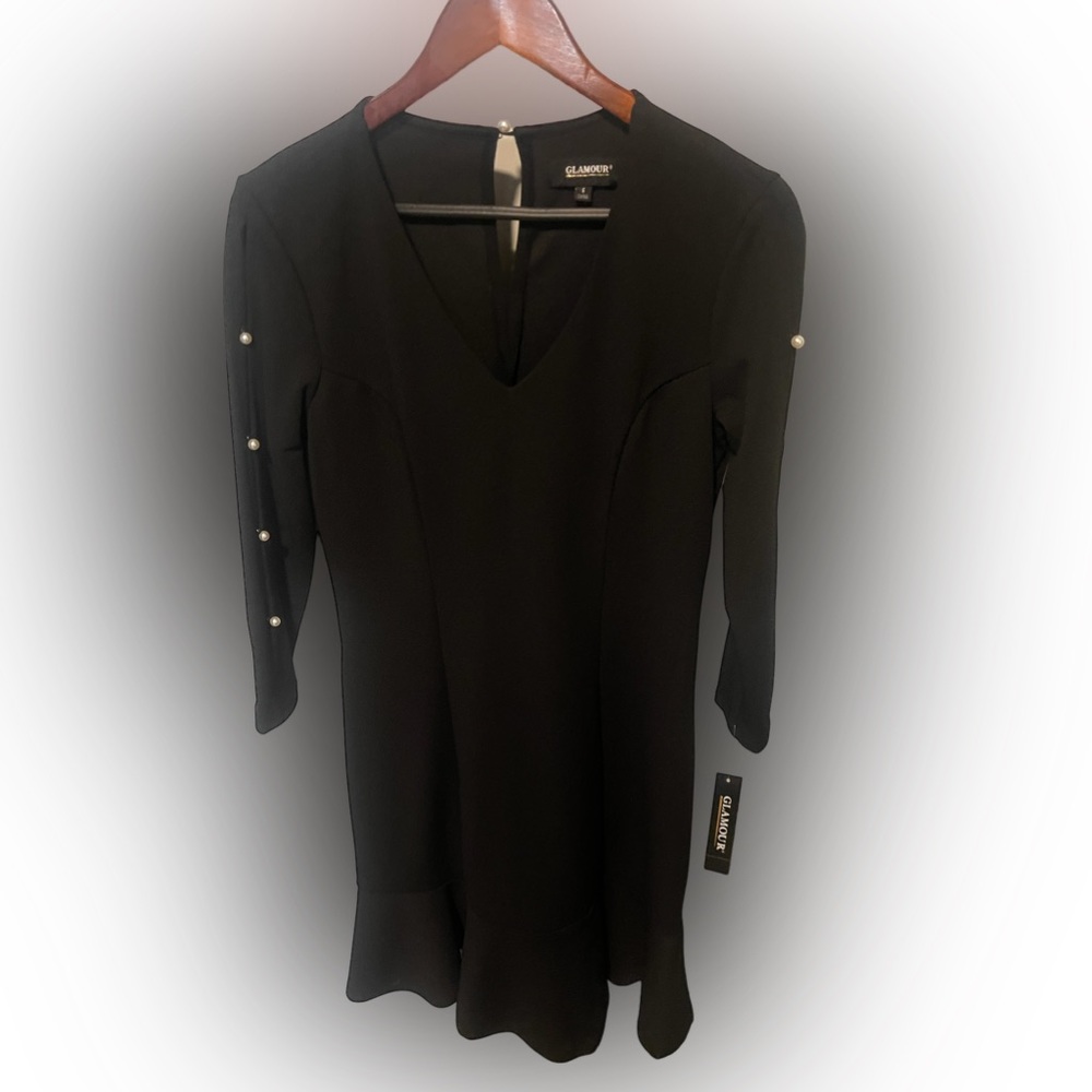 NWT! Black dress with pearl buttons down the sleeves.